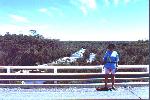 Christiane on a bridge with a stagnant river below